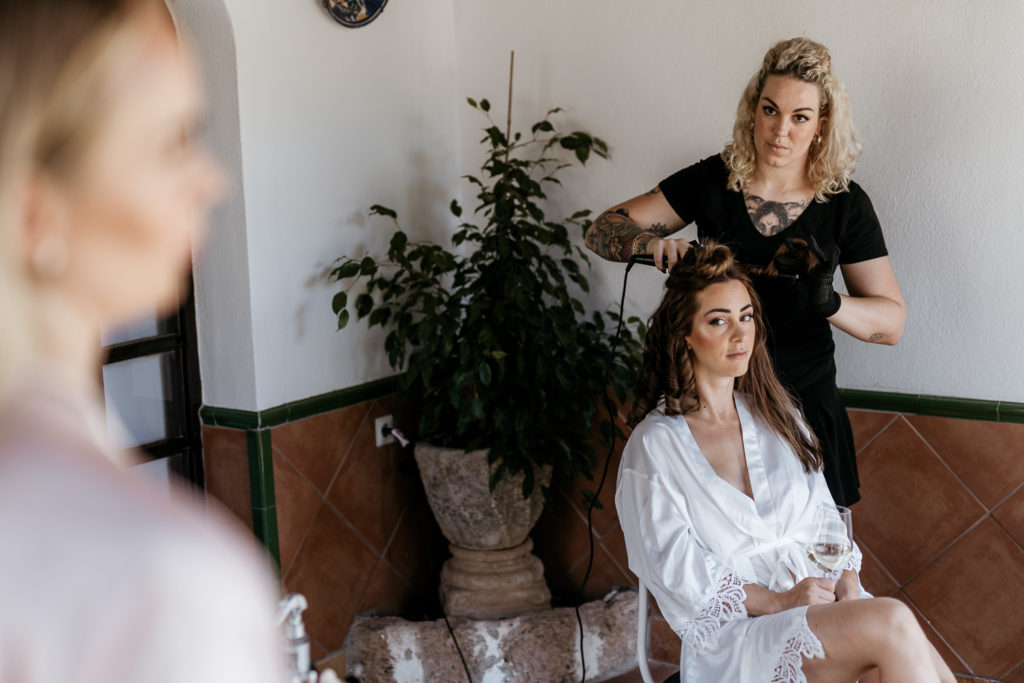 a woman getting her hair done