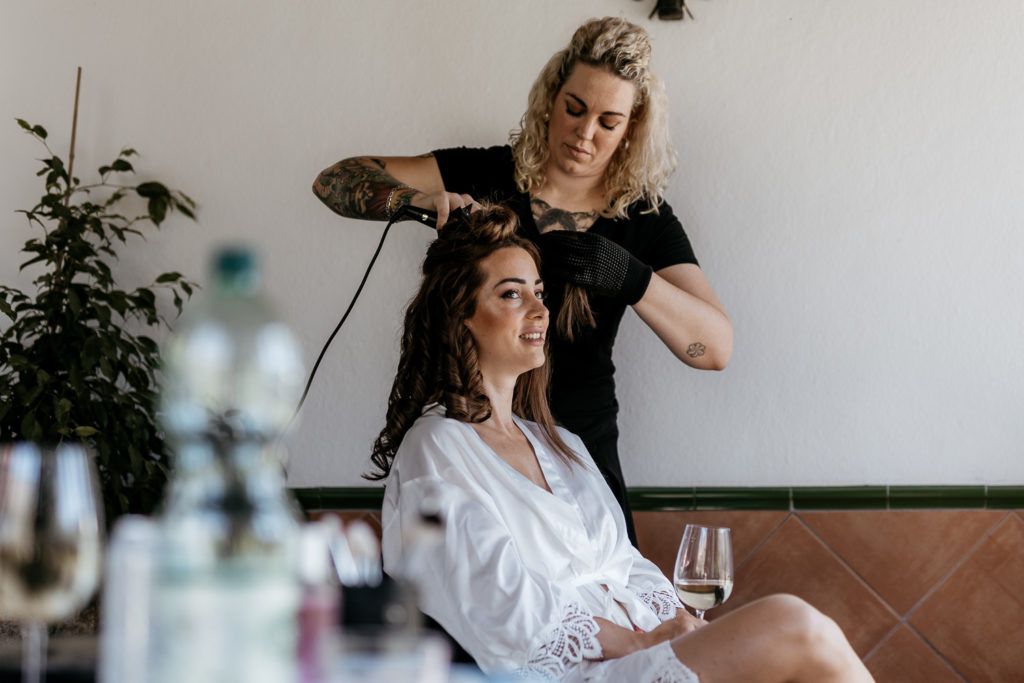 a woman getting her hair done