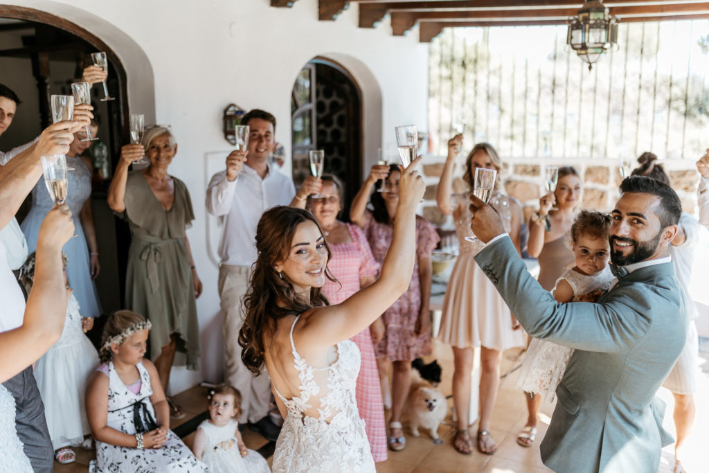 a group of people holding glasses of champagne