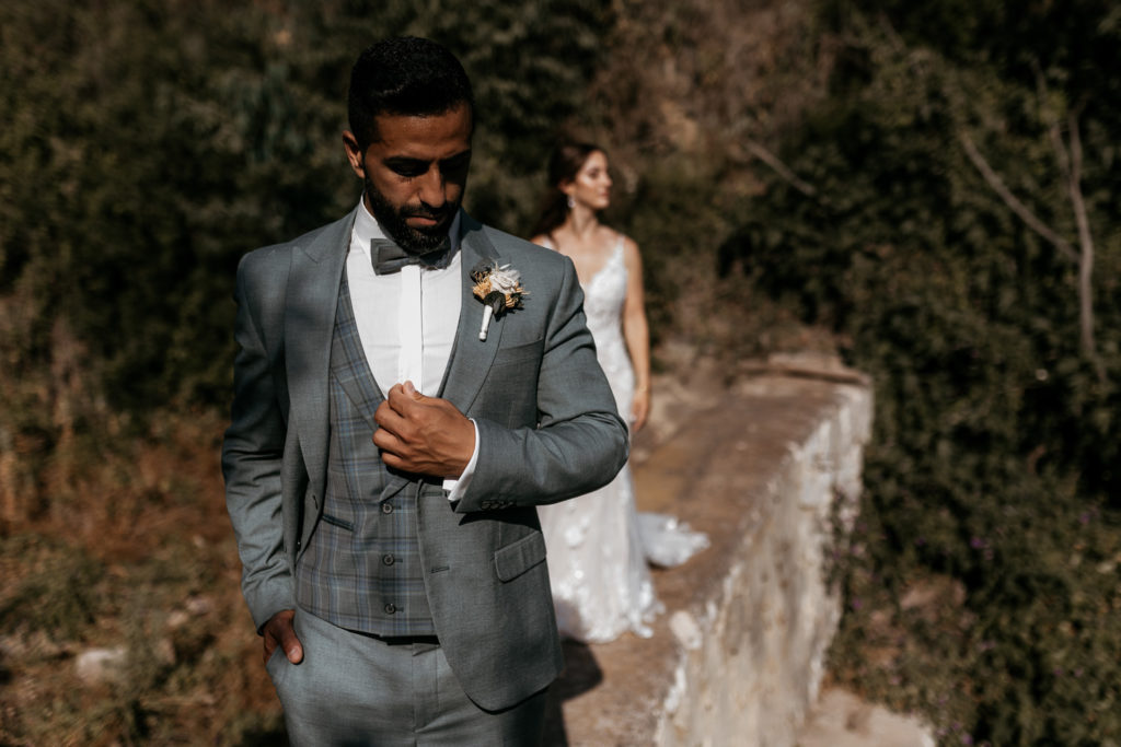 a man in a suit and bow tie