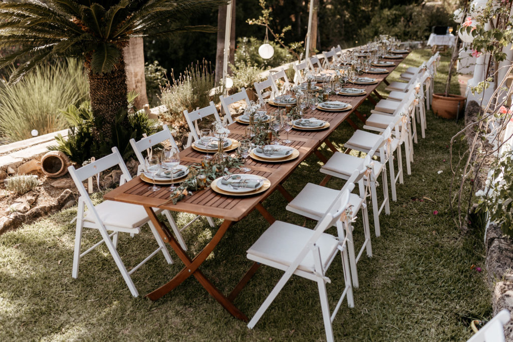 a long table with plates and plates on it