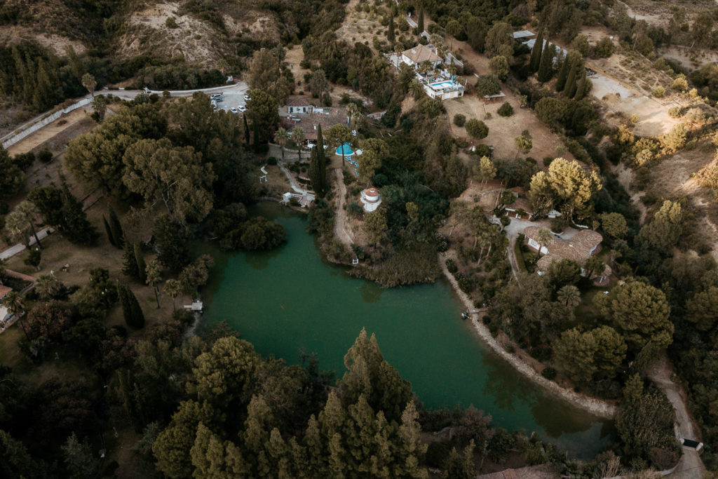 a body of water surrounded by trees