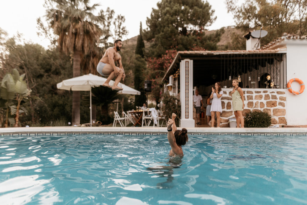 a person jumping into a pool