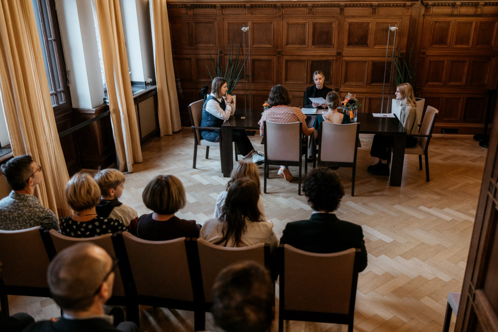 a group of people sitting around a table